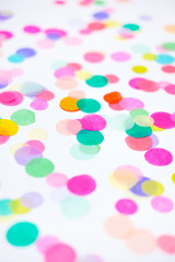 Closeup of colorful confetti on white background