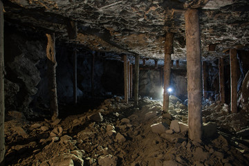 Underground emerald ore mine shaft tunnel gallery with light