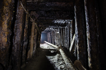 Underground emerald ore mine shaft tunnel gallery with light
