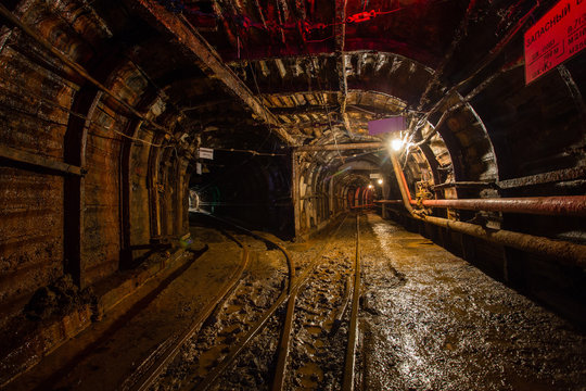 Underground emerald ore mine shaft tunnel gallery with light