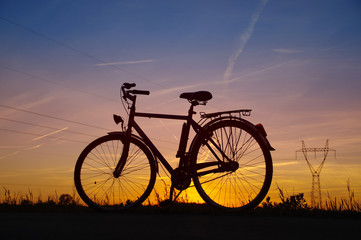 Fototapeta na wymiar Bicycle silhouette on sunset