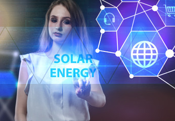 The concept of business, technology, the Internet and the network. A young entrepreneur working on a virtual screen of the future and sees the inscription: Solar energy