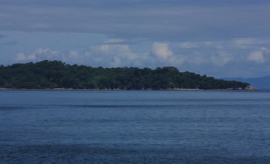 Coastal view of mountain range seen from a ferry ride from San Jose to La Playa Tambor, Costa Rica