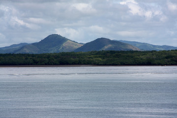 Coastal view of mountain range seen from a ferry ride from San Jose to La Playa Tambor, Costa Rica
