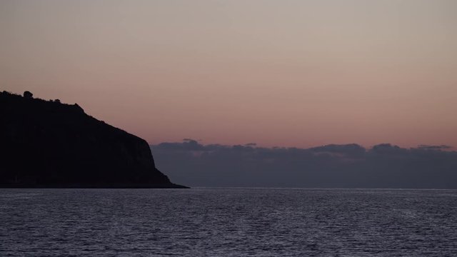 Sky after sunset over sea water surface, Greece Peloponnese