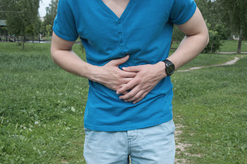 Man has stomachache. Adult has gastric