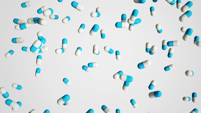 Pills falling on white background with Alpha