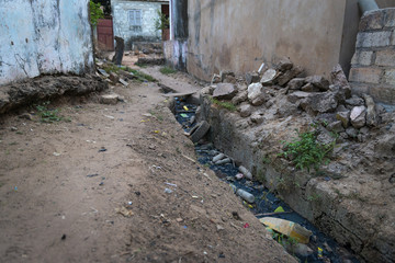 Open air sewer along a street at the Cupelon de Baixo neighborhood in the city of Bissau, Guinea Bissau. Guinea Bissau is one of the poorest countries in the world.