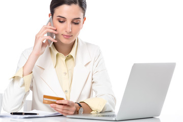 business woman showing credit card while working