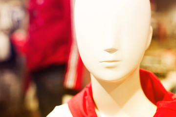 Face of the mannequin in a clothing store close-up, selective focus