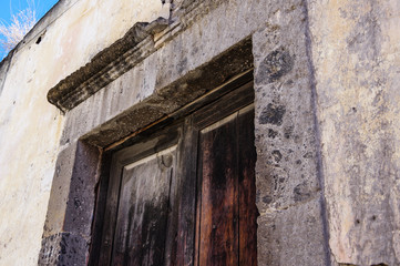 Fototapeta na wymiar Stone Lintel Above Rustic Wooden Door
