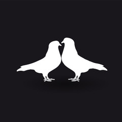 Silhouettes of two white doves on a black background.
