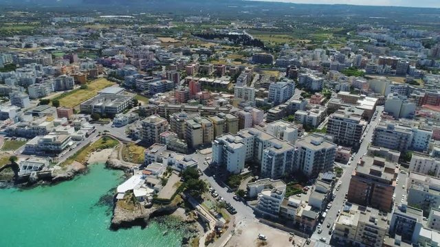 White city Monopoly and blue sea coastline in Italy Drone flight 4k