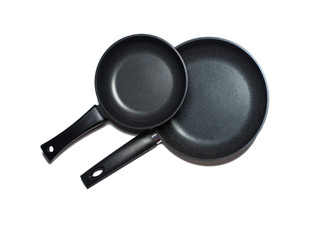 Two new non-stick pans isolated on a white background.