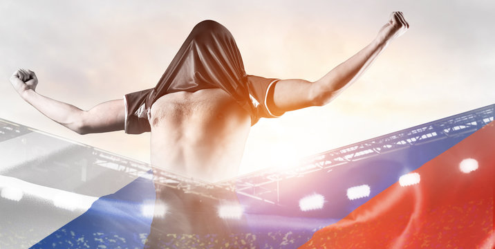 Russia national team. Double exposure photo of stadium and soccer or football player celebrating goal with his jersey on head