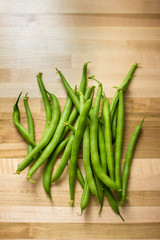 Bundle of green beans on butcher's block