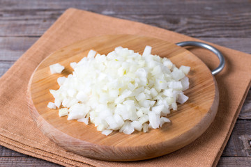 Sliced onion on a wooden cutting board