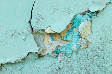 Background concrete wall, traces of weathering, worn wall damaged paint old paint. Remains of old paint on the painted concrete surface. Grungy destruction surface.