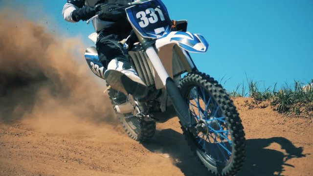 Pilot of an FMX bike is performing a sharp turn