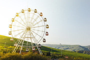 Ferris wheel with view on the mountains