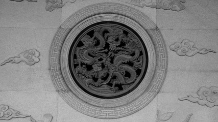 old chinese dragon stone by carve on the wall