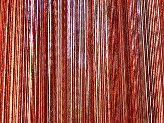 Background - curtains of threads on the window.