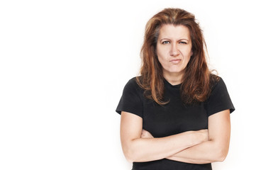 Beautiful woman on a white background with irritated hair and an angry face. It can be seen that a woman is good, but for some reason is angry - may her husband. Isolated