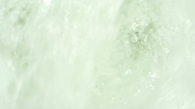 Toilet flushing, water splashing the toilet bowl