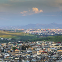 view to old and modern city with beautiful cloud in Morocco