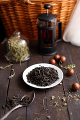black tea welding on a platter on a dark wooden background