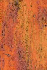 Texture of old orange wall with pealing paint