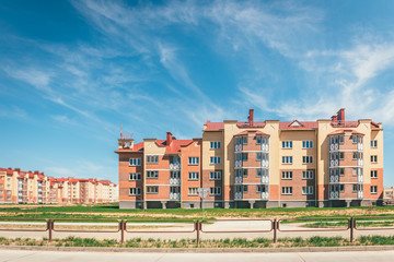 Fototapeta na wymiar Residential buildings with balconies in the city, urban development of apartment houses. Ostrovets, Belarus