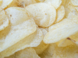 Close up on delicious salted potato chips fast food concept