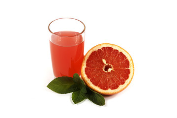 Fresh grapefruit juice with mint in a glass cup isolated on white background. Grapefruit fresh and juice on a white background, view of the shu, cospore space.
