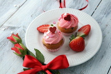 Delicious cupcake for Valentine Day. cake for Valentines day with chocolate and strawberries. Traditional homemade with red roses