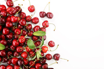 Cherry. Red fresh Cherries in bowl and a bunch of cherries on the table