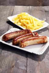 Grilled sausage served with french fries or fried potatoes with sausage