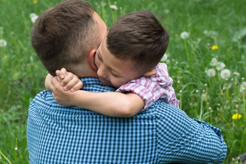 happy father and son embrace