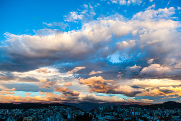 Spectacular sky with clouds of various colors, over the city of Quito