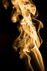 Smoke rising against black background