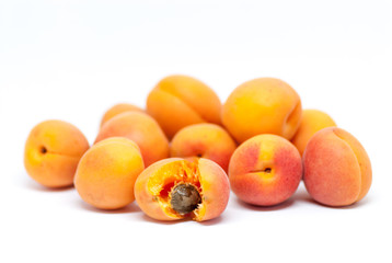 delicious ripe apricots on white