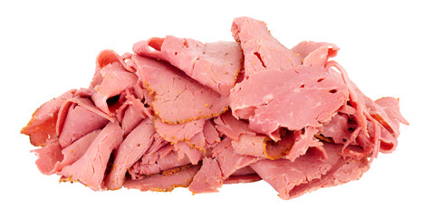 Pile of thinly sliced pastrami meat isolated on a white background