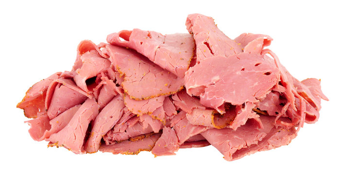 Pile Of Thinly Sliced Pastrami Meat Isolated On A White Background