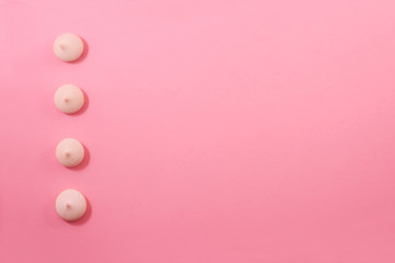 Zephyr biscuits on a light pink-red background.