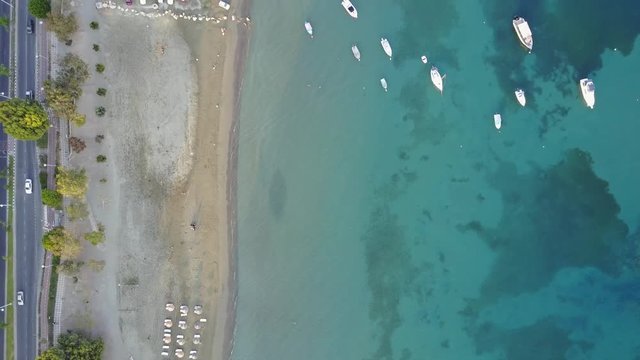 Wide aerial view looking down on a beach and boating area in Limassol, Cyprus