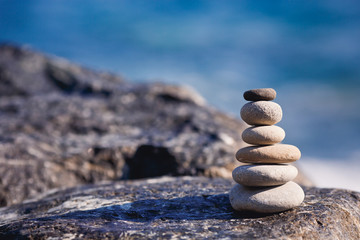 Balanced stone on a peddle beach 