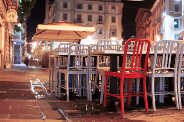 Chairs in a cafe in the night city