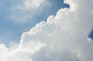 Naklejka na ściany i meble furry clouds on a blue sky on a beautiful summer