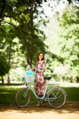 girl with vintage bicycle