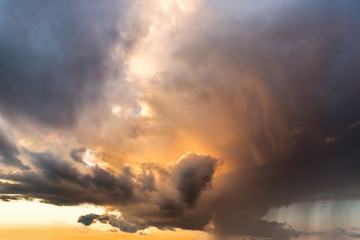 Fototapeta premium Sunset rain, cloudy burning sky